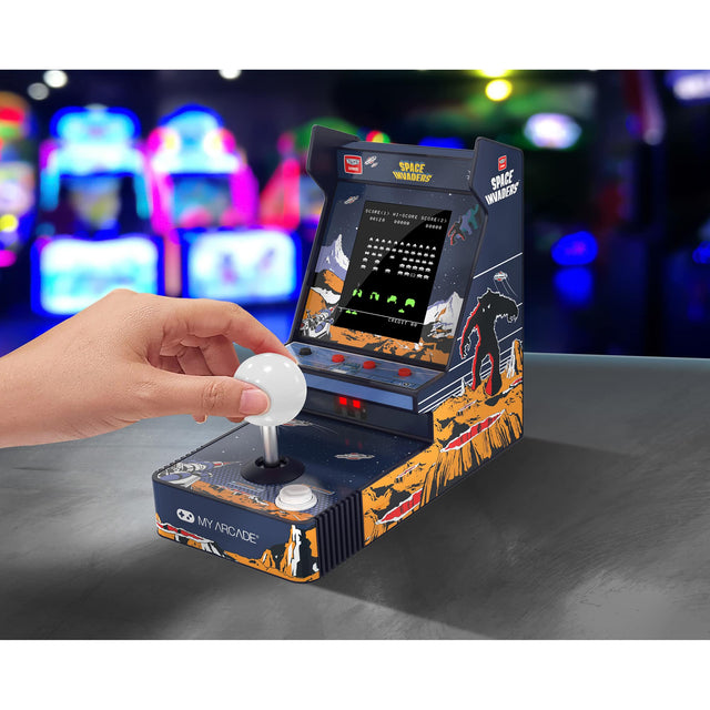 Space Invaders is a classic arcade game that has been adapted into a home arcade machine. The machine features a joystick and a button for gameplay, and it is designed to resemble the original arcade cabinet. The game is displayed on a screen, and the player uses the joystick and button to control the game. The machine is a fun and nostalgic way to enjoy the classic game at home.