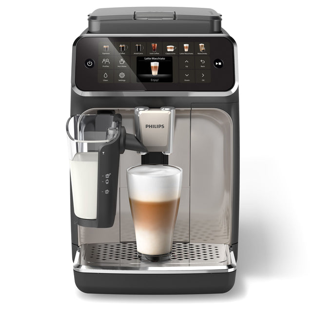 The image features a black and silver coffee maker with a beverage in it. The beverage appears to be a frothy, foamy drink, possibly a latte or a macchiato. The coffee maker is made by Philips, as indicated by the brand name displayed on the machine.
