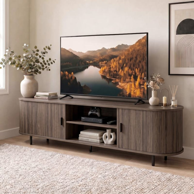 Front. WELLFOR - 71" TV Stand for TVs up to 80", Mid Century Curved Entertainment Center with Fluted Sliding Doors - Walnut.